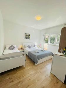 Postel nebo postele na pokoji v ubytování Apartman & rooms Draga