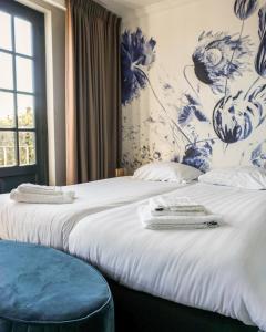 Säng eller sängar i ett rum på "Het Wapen Van Willemstad"
