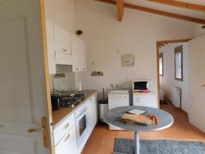 A kitchen or kitchenette at La petite maison dans la prairie