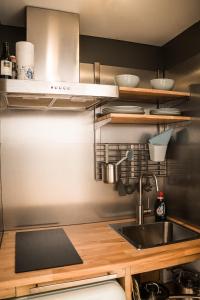 a kitchen with a sink and a counter at Vitamine Zee in IJmuiden +20 photos