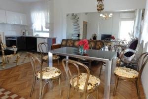 a living room with a table and chairs at Croatia Zadar Borik big Family Apartment with garden view Number 6 in Zadar