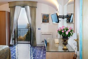 TV a/nebo společenská místnost v ubytování Villa Borgo San Michele