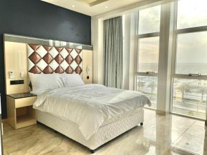 Ένα ή περισσότερα κρεβάτια σε δωμάτιο στο Asian Hotel