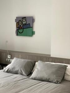 Postel nebo postele na pokoji v ubytování Apartaments El Cine