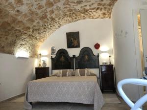 Una cama o camas en una habitación de Dimora Umberto - Dammuso Suite