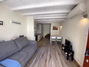 a living room with a couch and a table at Lagos Center House in Lagos
