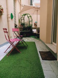 Nice appartement cosy + patio privéにある庭