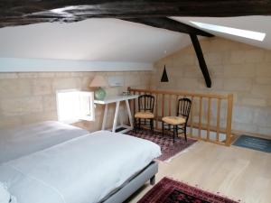 Tempat tidur dalam kamar di 12 Rue des Ecoles
