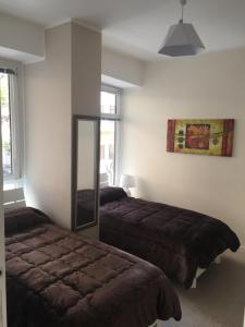 Postel nebo postele na pokoji v ubytování George House Palermo