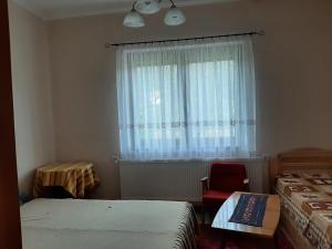 Posteľ alebo postele v izbe v ubytovaní Farkas Piroska Vendégház