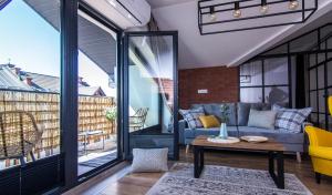 Posedenie v ubytovaní Apartamenty W37