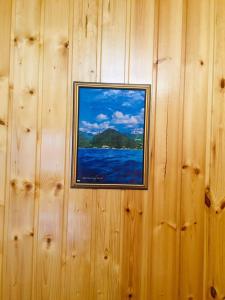 een foto van de oceaan op een houten muur bij Дом под ключ Арабика in Gagra