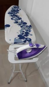 a purple and white chair sitting on a table at Le refuge privatif de Julie in Basse-Pointe