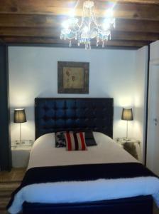 מיטה או מיטות בחדר ב-Maison Elena