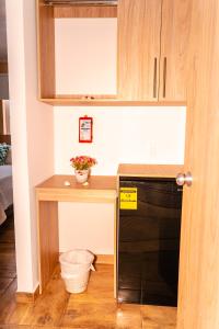 a kitchen with a counter and a black dishwasher at Summer Breeze in San Andrés +82 photos