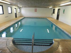 a large swimming pool in a building at The Waie Inn in Copplestone