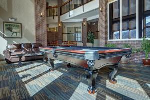 a pool table in a living room with a couch at Club Wyndham Durango in Durango