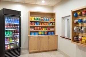 a refrigerator in a store aisle with drinks at Holiday Inn Express Hotel & Suites Opelika Auburn, an IHG Hotel in Opelika