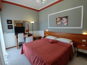 Кровать или кровати в номере Hotel Minerva