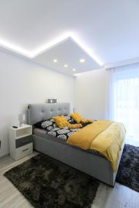 Posteľ alebo postele v izbe v ubytovaní Sunshine Resort Yellow Apartman