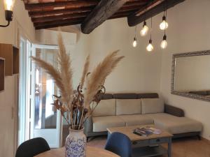 a living room with a couch and a table at La Ramade de Saint-Tropez in Saint-Tropez