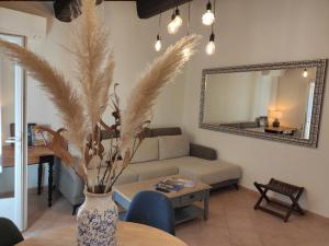 a living room with a couch and a table at La Ramade de Saint-Tropez in Saint-Tropez +9 photos