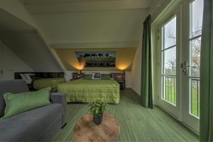 Ένα ή περισσότερα κρεβάτια σε δωμάτιο στο De Willigen Logies