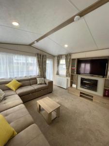 Khu vực ghế ngồi tại Tigers Wood - 2 bed hot tub lodge with free golf, NO BUGGY