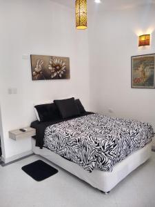 Postel nebo postele na pokoji v ubytování La Habitación Perfecta