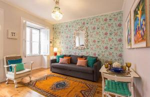 a living room with a couch and a table at Shabby Chic Flat 2 in Lisbon