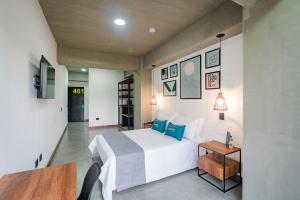 Postel nebo postele na pokoji v ubytování Loft 32 Medellín Living + 21 fotografií