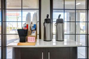 a counter with two kettles on top of it at Motel 6-Amarillo, TX - Airport in Amarillo