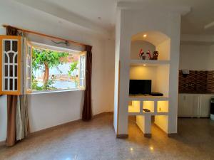 TV a/nebo společenská místnost v ubytování Spring Hotel Luxor
