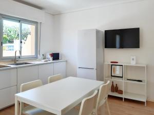 Televízia a/alebo spoločenská miestnosť v ubytovaní PAPPA casa vacanze