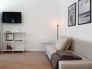 Televízia a/alebo spoločenská miestnosť v ubytovaní PAPPA casa vacanze