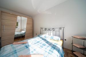 Posteľ alebo postele v izbe v ubytovaní Apartman Grand