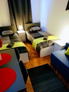 Posteľ alebo postele v izbe v ubytovaní Pula Center Arena Belvedere Apartments and Rooms
