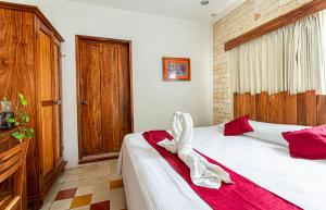 Ein Bett oder Betten in einem Zimmer der Unterkunft Hotel Boutique Casa Hipil