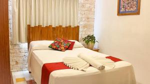 Ein Bett oder Betten in einem Zimmer der Unterkunft Hotel Boutique Casa Hipil