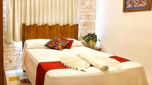 Ein Bett oder Betten in einem Zimmer der Unterkunft Hotel Boutique Casa Hipil