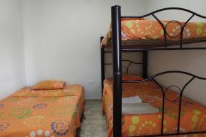 Postel nebo postele na pokoji v ubytování Melgar-Tolima Casa la estrella I + 23 fotografií