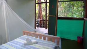 A bed or beds in a room at Daintree Crocodylus 