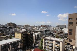 widok na miasto z wysokimi budynkami w obiekcie Gamadas BLD w Tokio