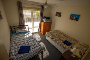 מיטה או מיטות בחדר ב-Park View, Maitland