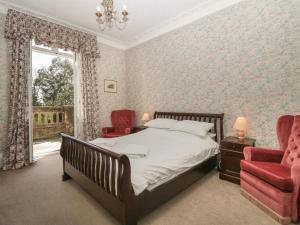 Postel nebo postele na pokoji v ubytování Milton Manor