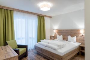 Łóżko lub łóżka w pokoju w obiekcie A Casa Saphir Appartement-Hotel