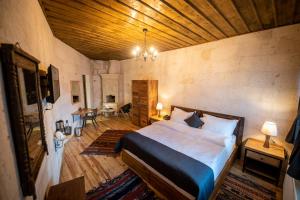 Postel nebo postele na pokoji v ubytování Duven Hotel Cappadocia