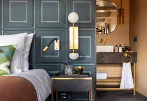 a bedroom with a bed and a mirror at Poorter Boutique Hotel Brielle in Brielle +68 photos