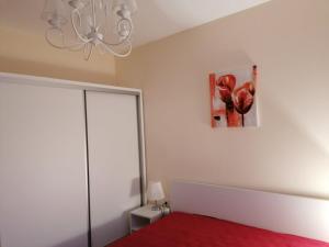 A bed or beds in a room at By the Waves luxury beach apartment