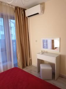 A bed or beds in a room at By the Waves luxury beach apartment